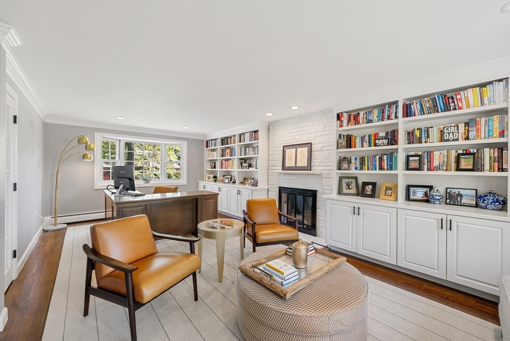 60 Perry Drive Westwood, MA 02090 - Photo 5 of 42 a living room with furniture a rug and a book shelf