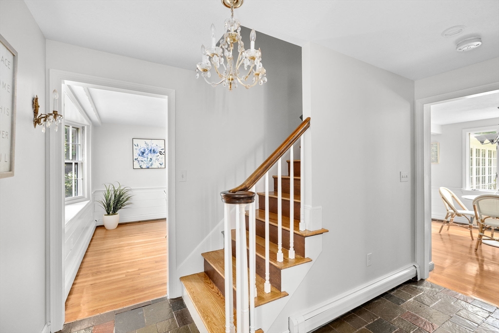 16 Liberty Road Hingham, MA 02043 - Photo 16 of 27 a view of a hallway with wooden floor and stairs