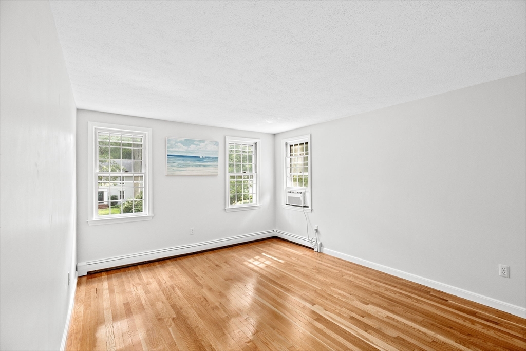 16 Liberty Road Hingham, MA 02043 - Photo 17 of 27 an empty room with wooden floor and windows