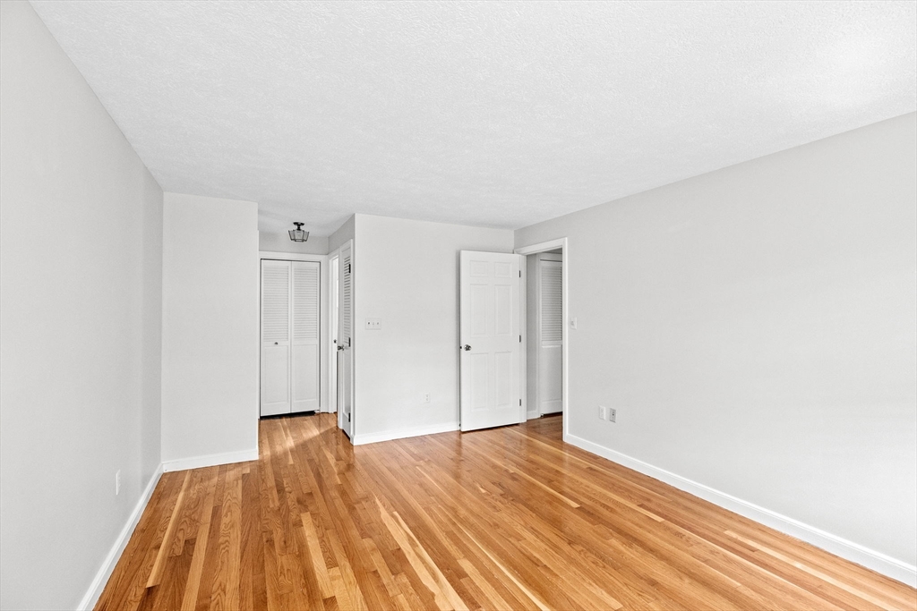 16 Liberty Road Hingham, MA 02043 - Photo 18 of 27 a view of empty room with wooden floor