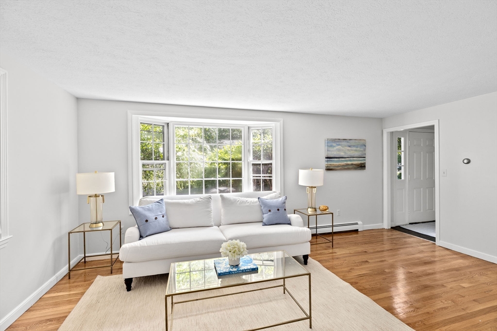 16 Liberty Road Hingham, MA 02043 - Photo 2 of 27 a living room with furniture and a table