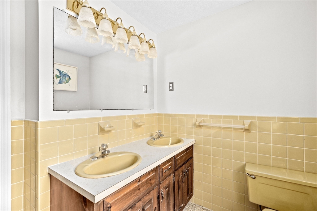 16 Liberty Road Hingham, MA 02043 - Photo 22 of 27 a bathroom with a sink and a mirror