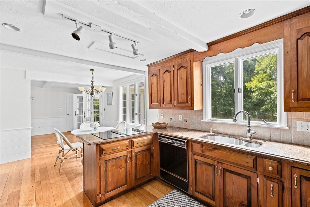 16 Liberty Road Hingham, MA 02043 - Photo 8 of 27 a kitchen with a sink stove and cabinets