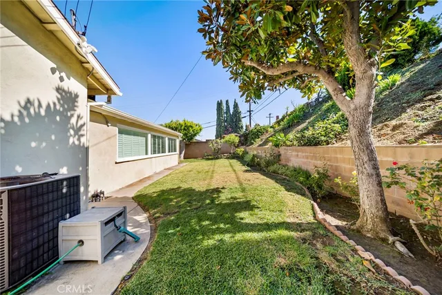 a backyard of a house with lots of green space