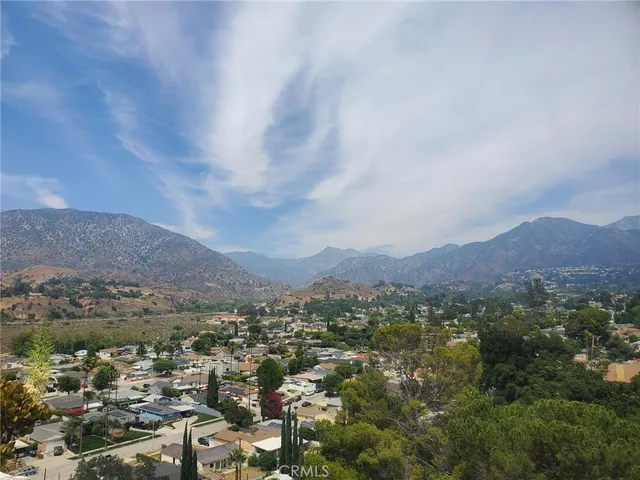 an aerial view of residential house and mountains around