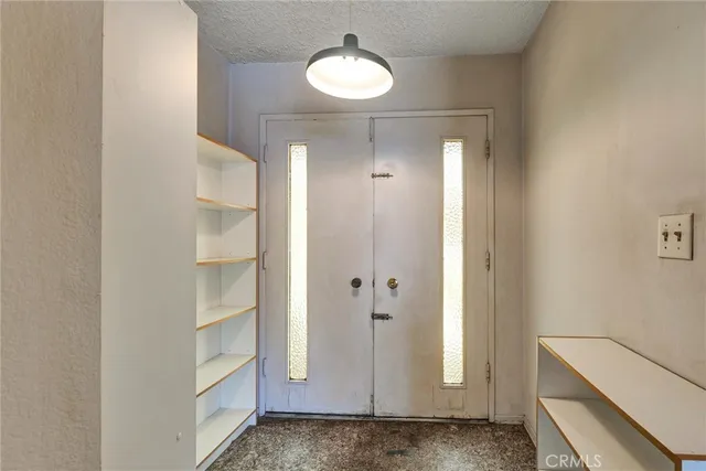 a view of a hallway with closet
