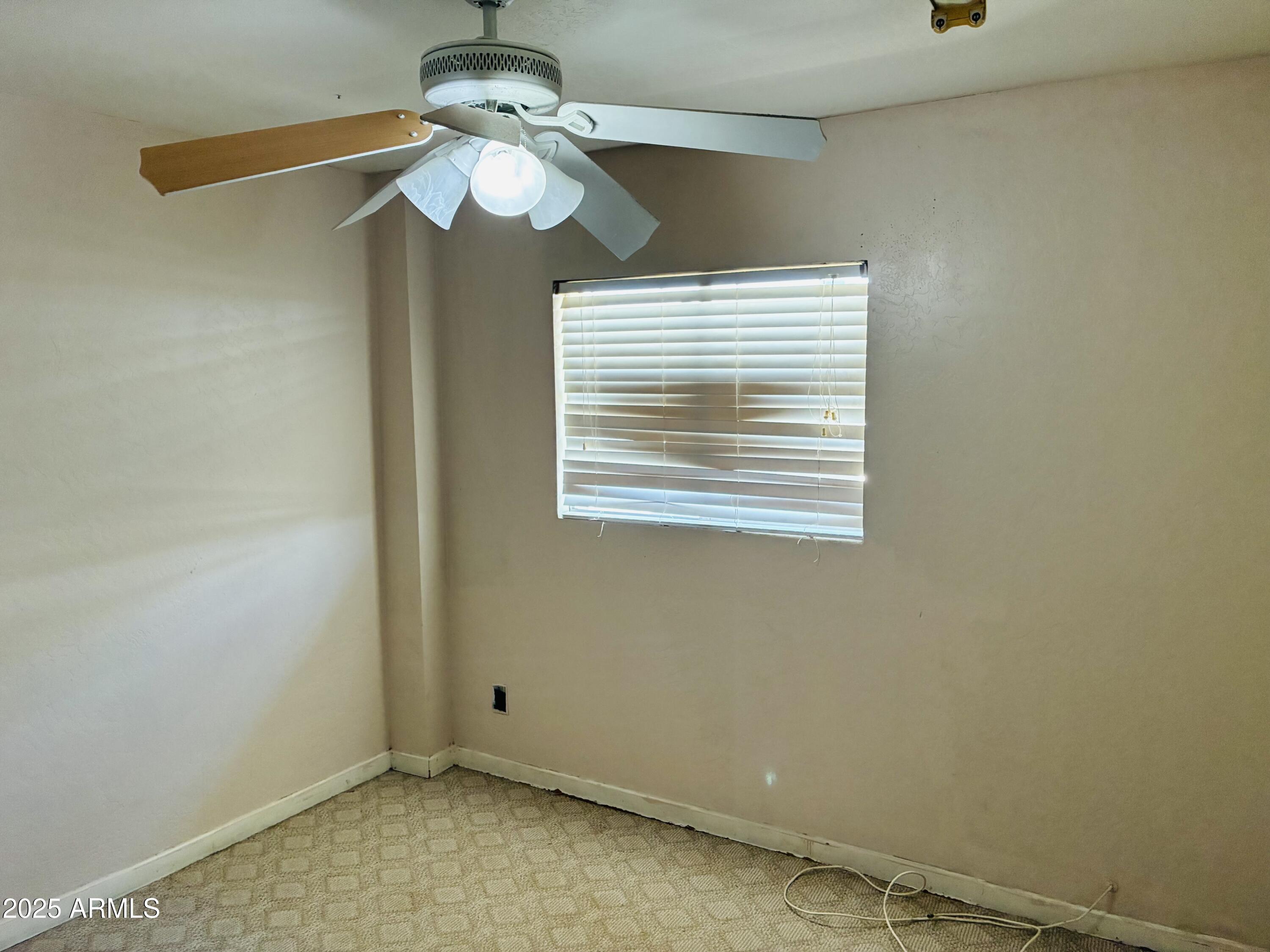 Undisclosed Address Tempe, AZ 85282 - Photo 17 of 23 a view of an empty room with a window