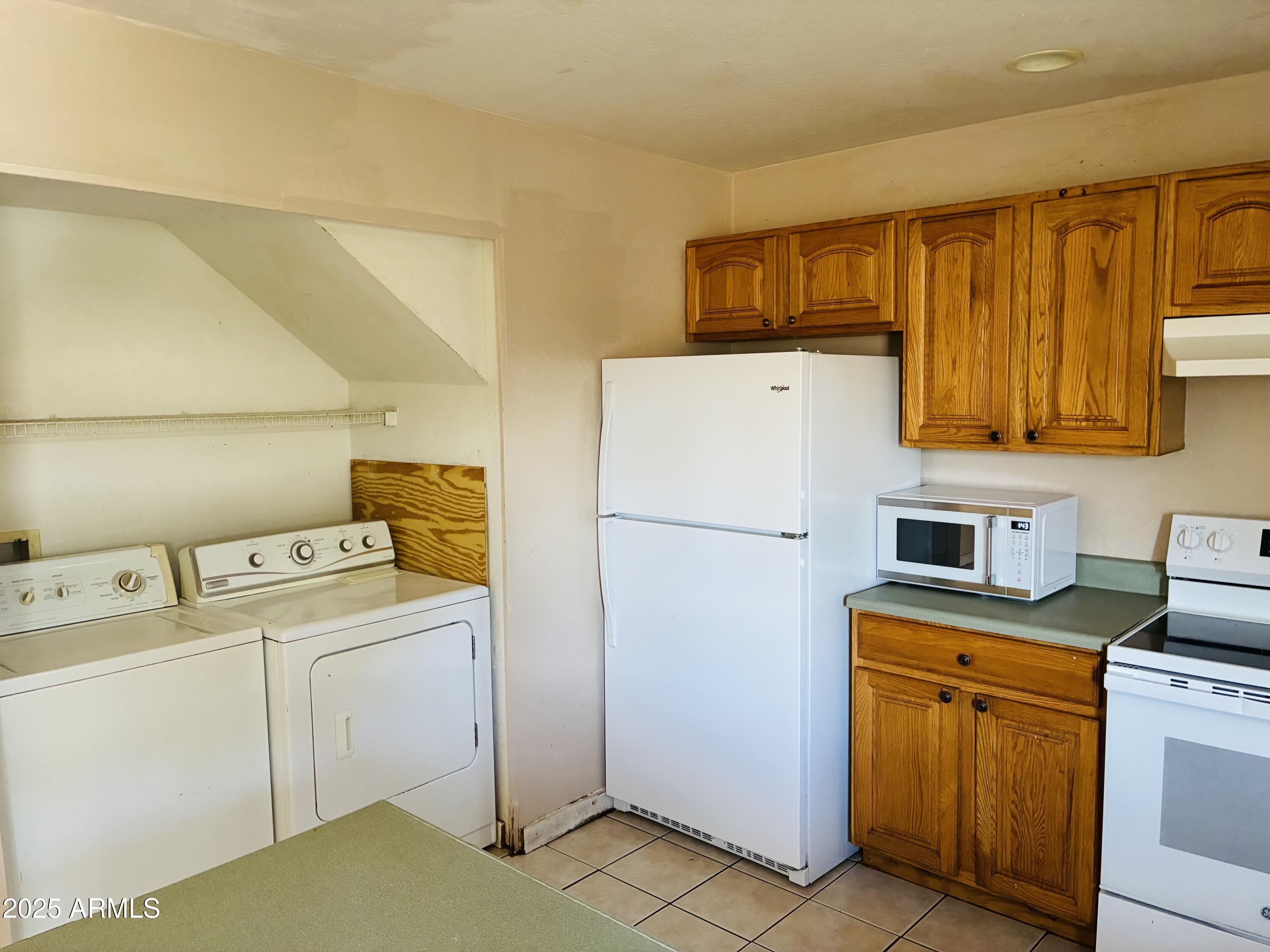 Undisclosed Address Tempe, AZ 85282 - Photo 2 of 23 a utility room with dryer and washer