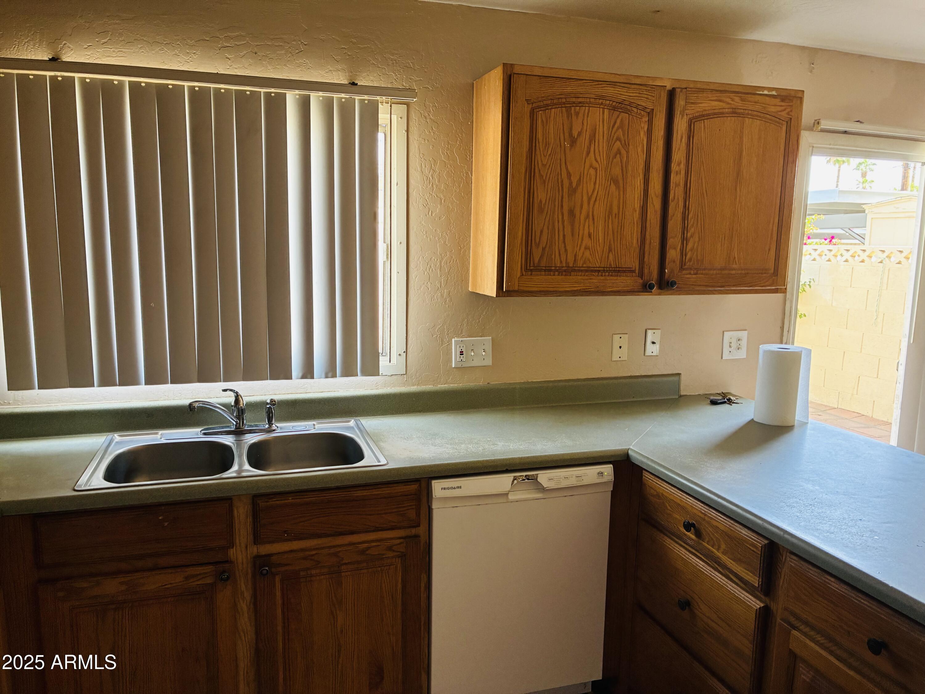 Undisclosed Address Tempe, AZ 85282 - Photo 4 of 23 a kitchen with a sink and cabinets