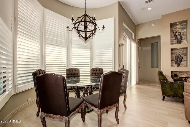 a dining room with furniture and windows