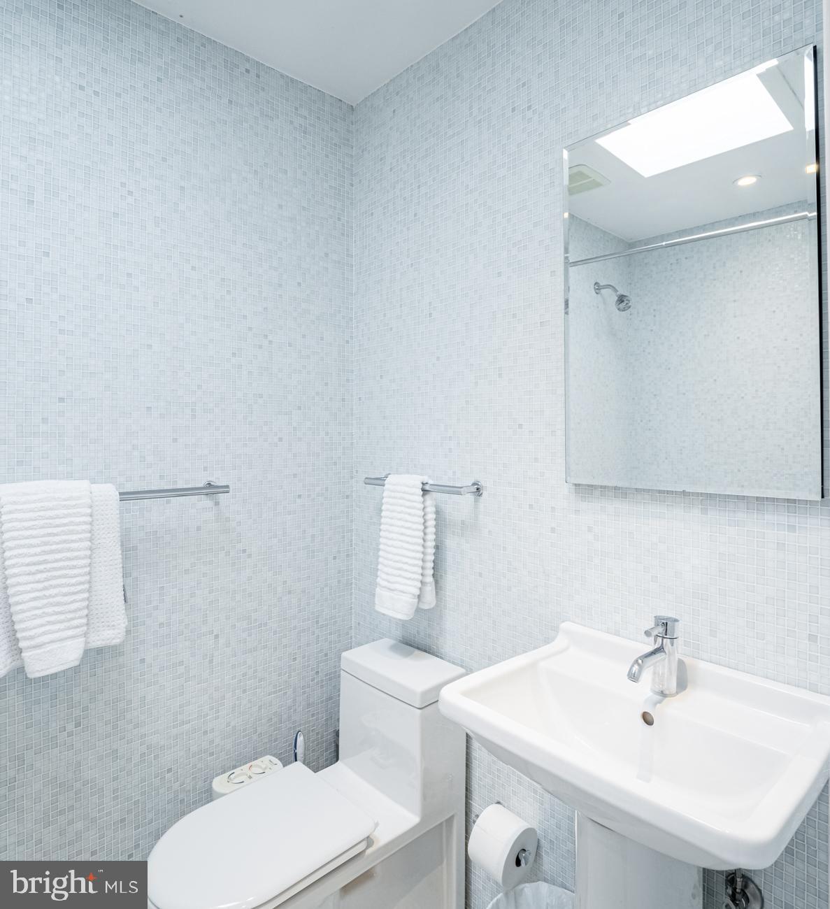 3500 P Street Northwest Washington, DC 20007 - Photo 14 of 15 a bathroom with a sink a toilet and mirror