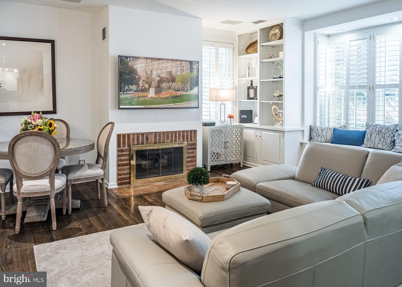 3500 P Street Northwest Washington, DC 20007 - Photo 7 of 15 a living room with furniture and a fireplace