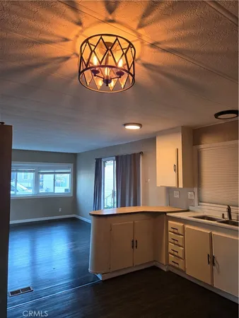 wooden floor with a kitchen windows
