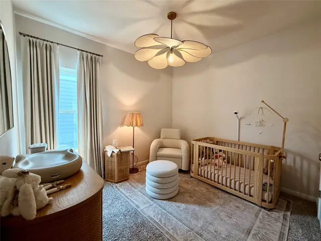 a bedroom with furniture and a window