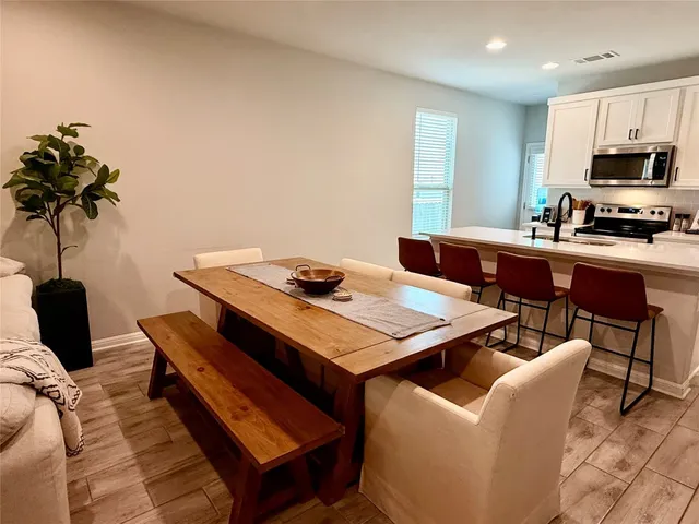 a view of a dining room with furniture