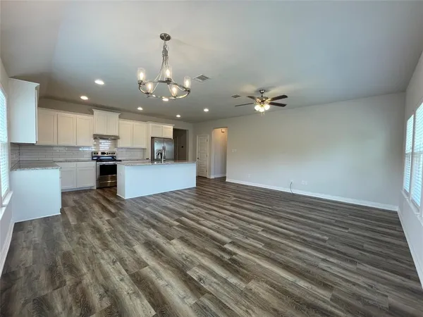 a view of a kitchen with a sink and cabinets
