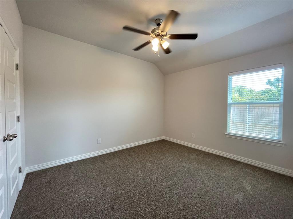 206 South Nolan River Road, Unit 6 Cleburne, TX 76033 - Photo 13 of 16 an empty room with a window and a fan