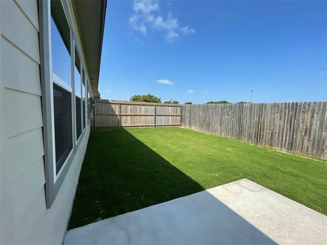 a view of a backyard with garden