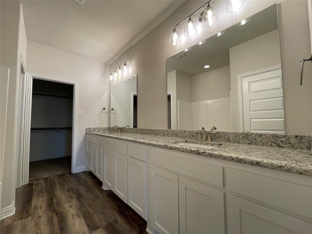 206 South Nolan River Road, Unit 6 Cleburne, TX 76033 - Photo 7 of 16 a bathroom with a sink and a mirror