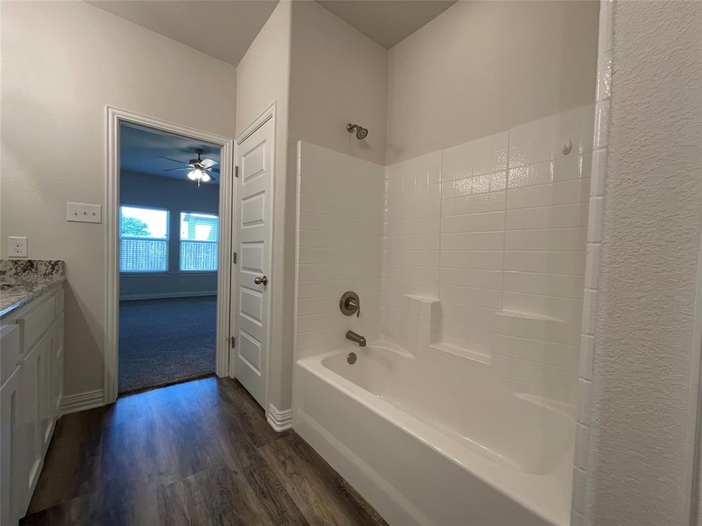 206 South Nolan River Road, Unit 6 Cleburne, TX 76033 - Photo 8 of 16 a bathroom with a bathtub and shower