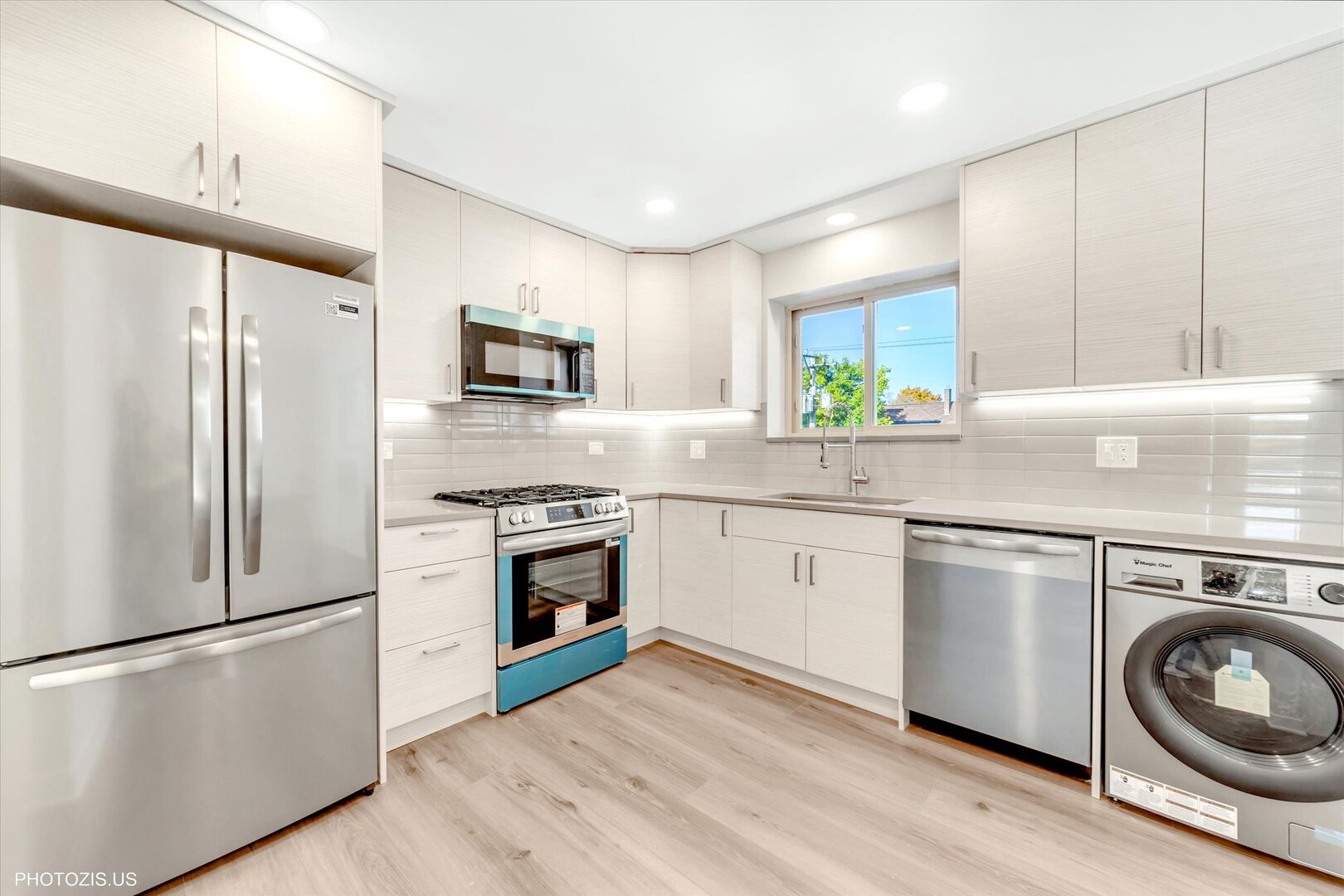 1640 West Sherwin Avenue, Unit 3B Chicago, IL 60626 - Photo 7 of 28 a kitchen with a refrigerator sink and stove top oven