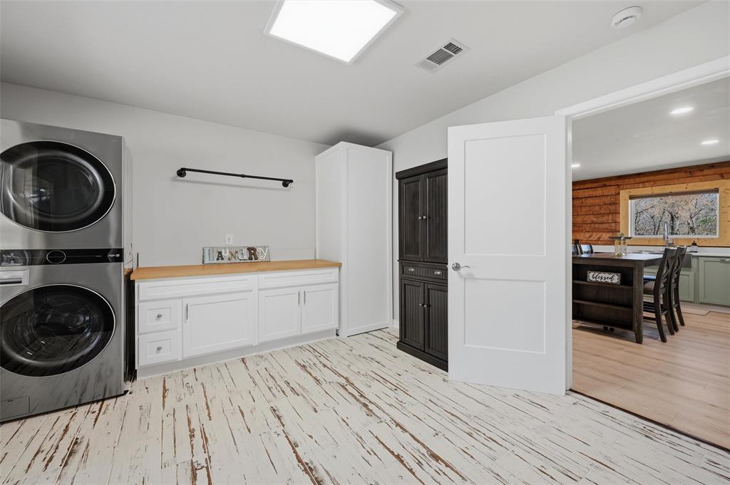 230 Frosty Hollow Road Denison, TX 75021 - Photo 16 of 40 a view of a kitchen with dishwasher and wooden floor