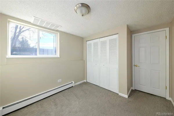a living room with furniture rug and window