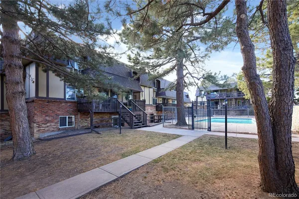 a view of swimming pool with trees