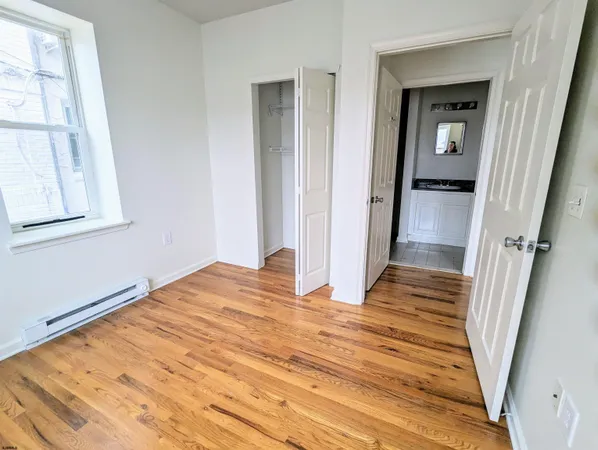 a view of a room with wooden floor and stairs