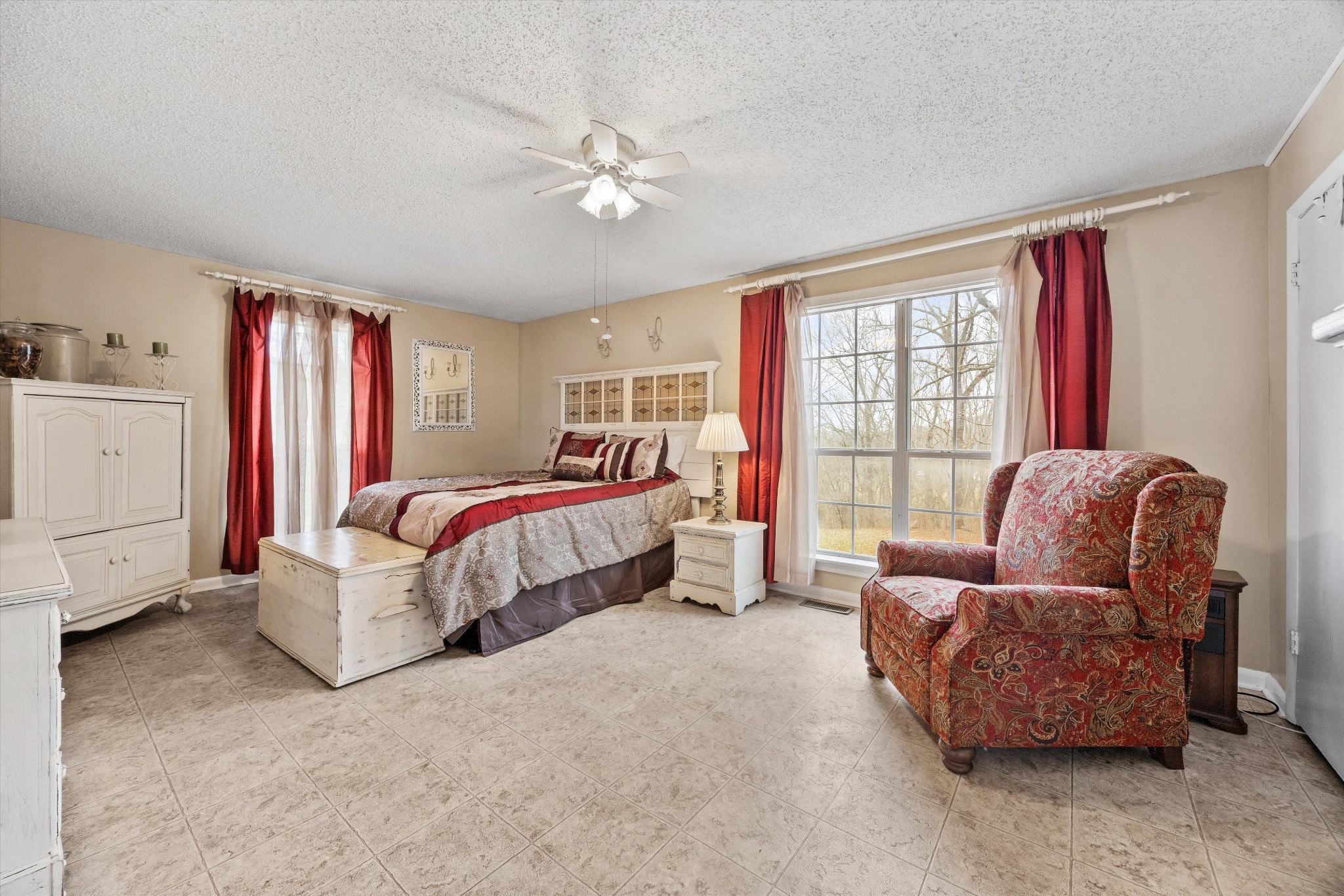 631 Holt Hollow Road Prospect, TN 38477 - Photo 11 of 41 a spacious bedroom with a bed and glass window