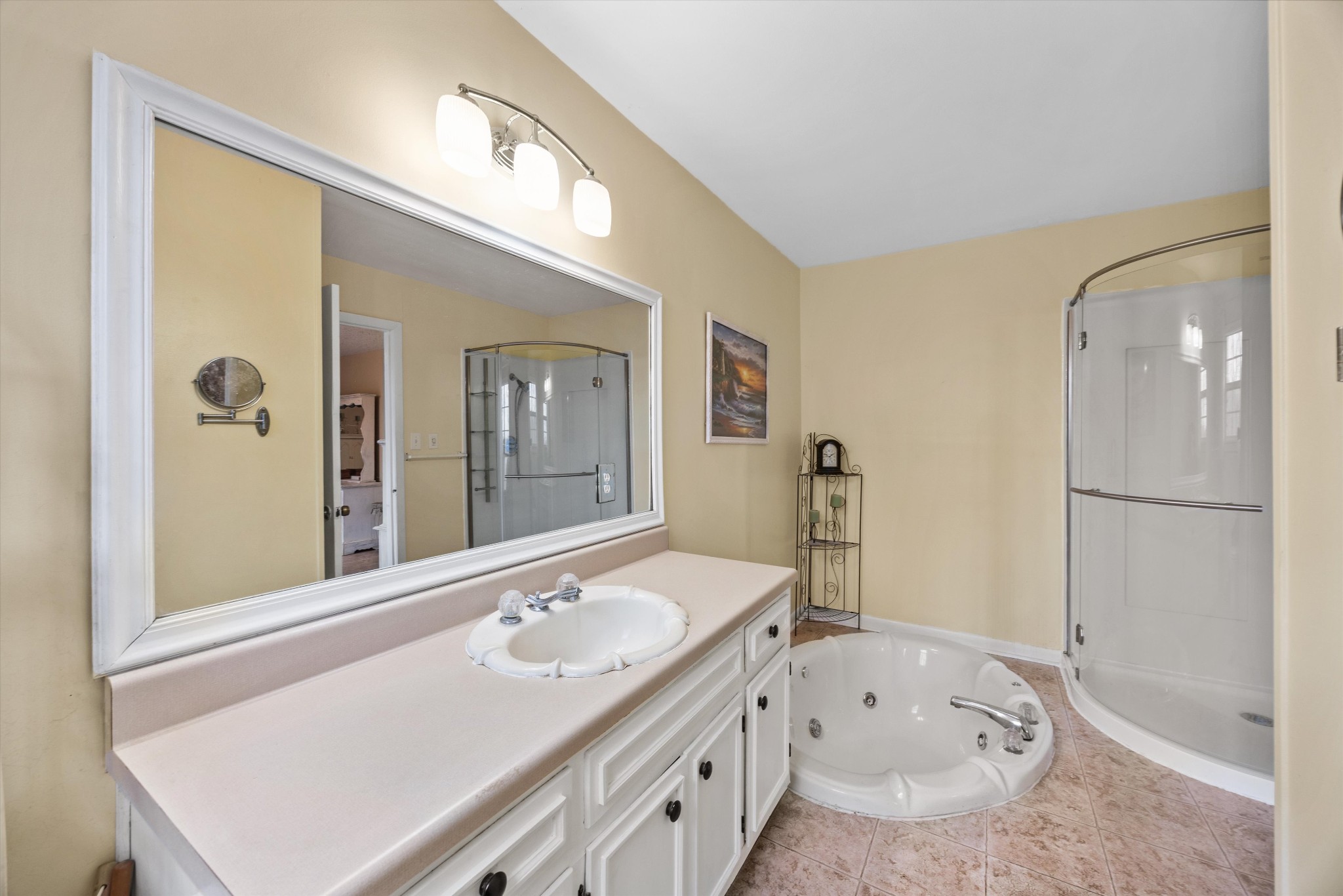 631 Holt Hollow Road Prospect, TN 38477 - Photo 14 of 41 a bathroom with a tub sink and mirror