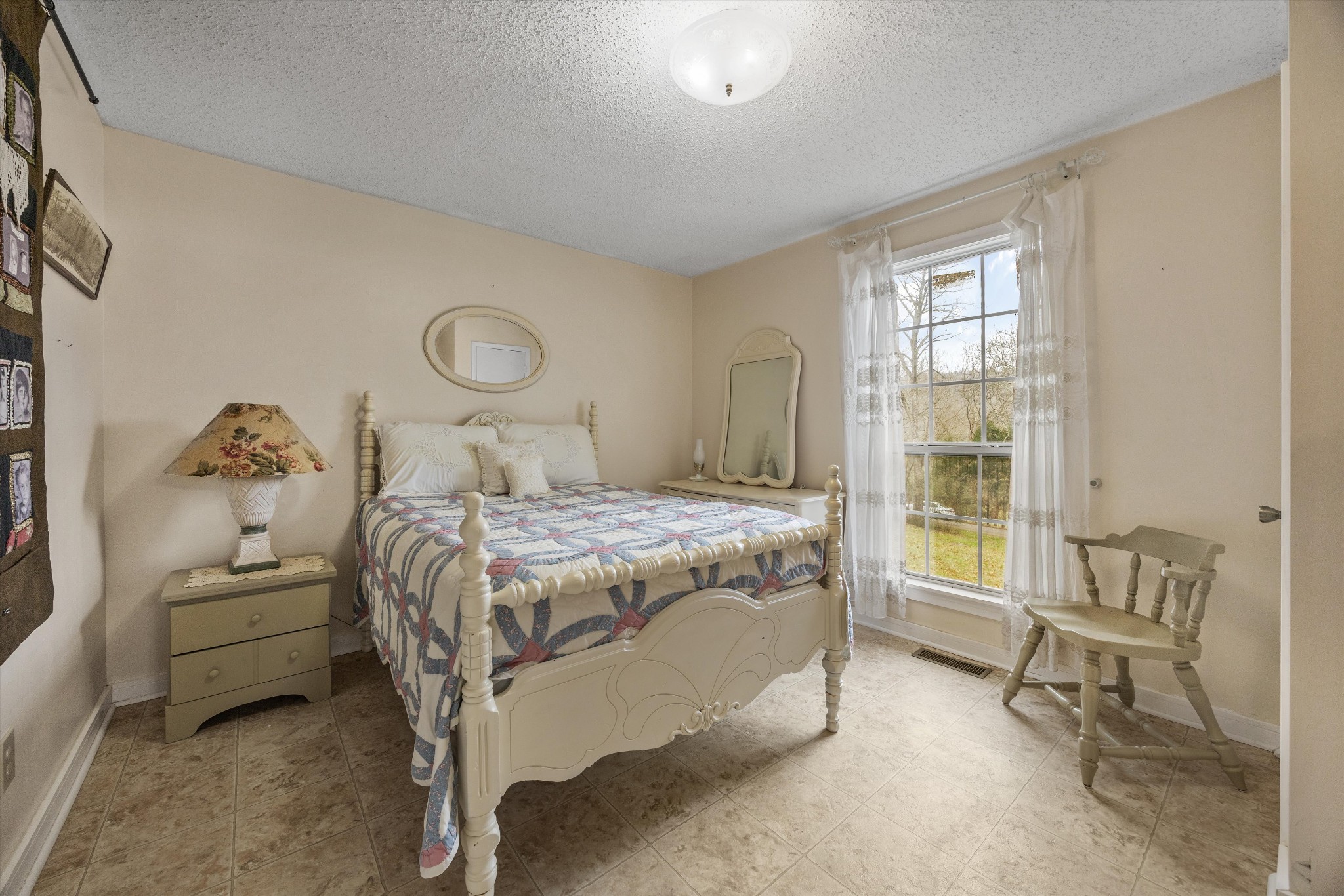 631 Holt Hollow Road Prospect, TN 38477 - Photo 16 of 41 a bedroom with a bed and a window