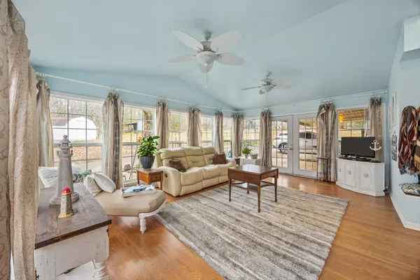 a living room with furniture and a large window