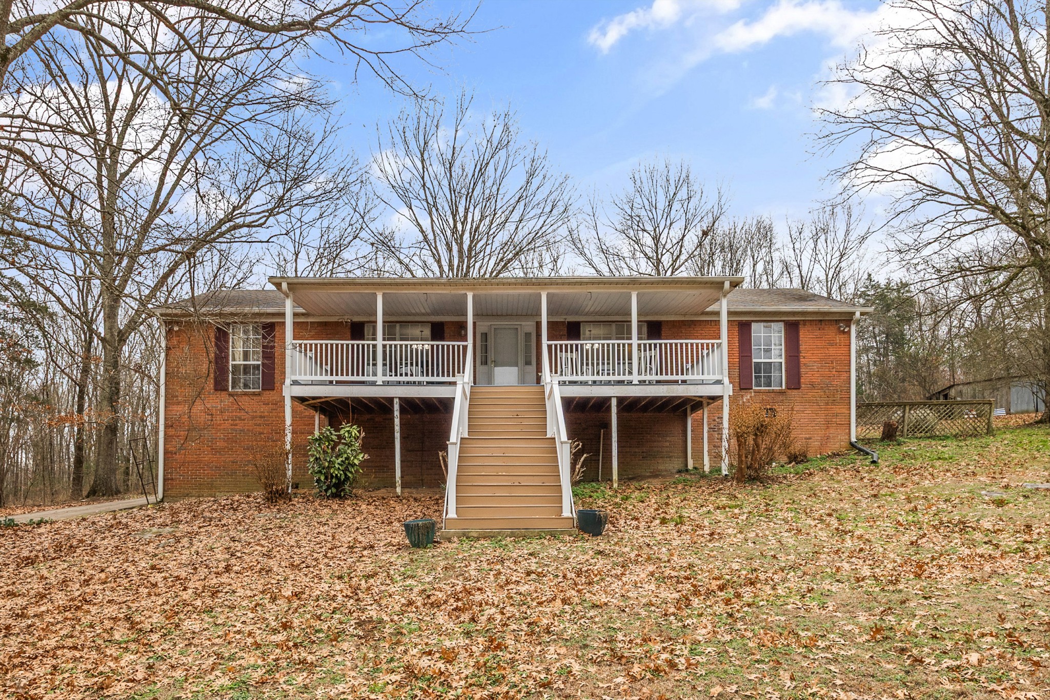 631 Holt Hollow Road Prospect, TN 38477 - Photo 2 of 41 a front view of a house with a yard and garage