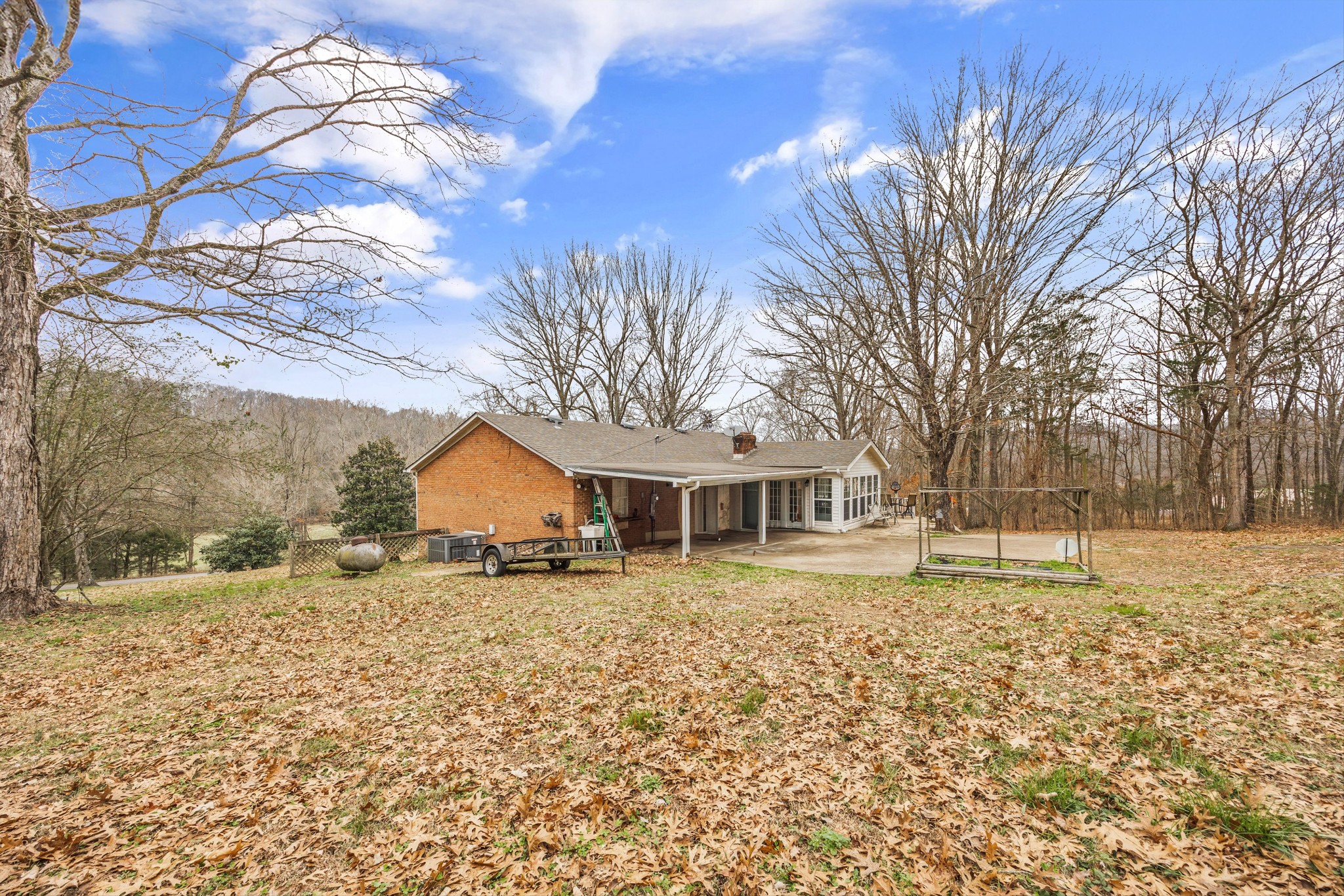 631 Holt Hollow Road Prospect, TN 38477 - Photo 24 of 41 a front view of a house with a yard