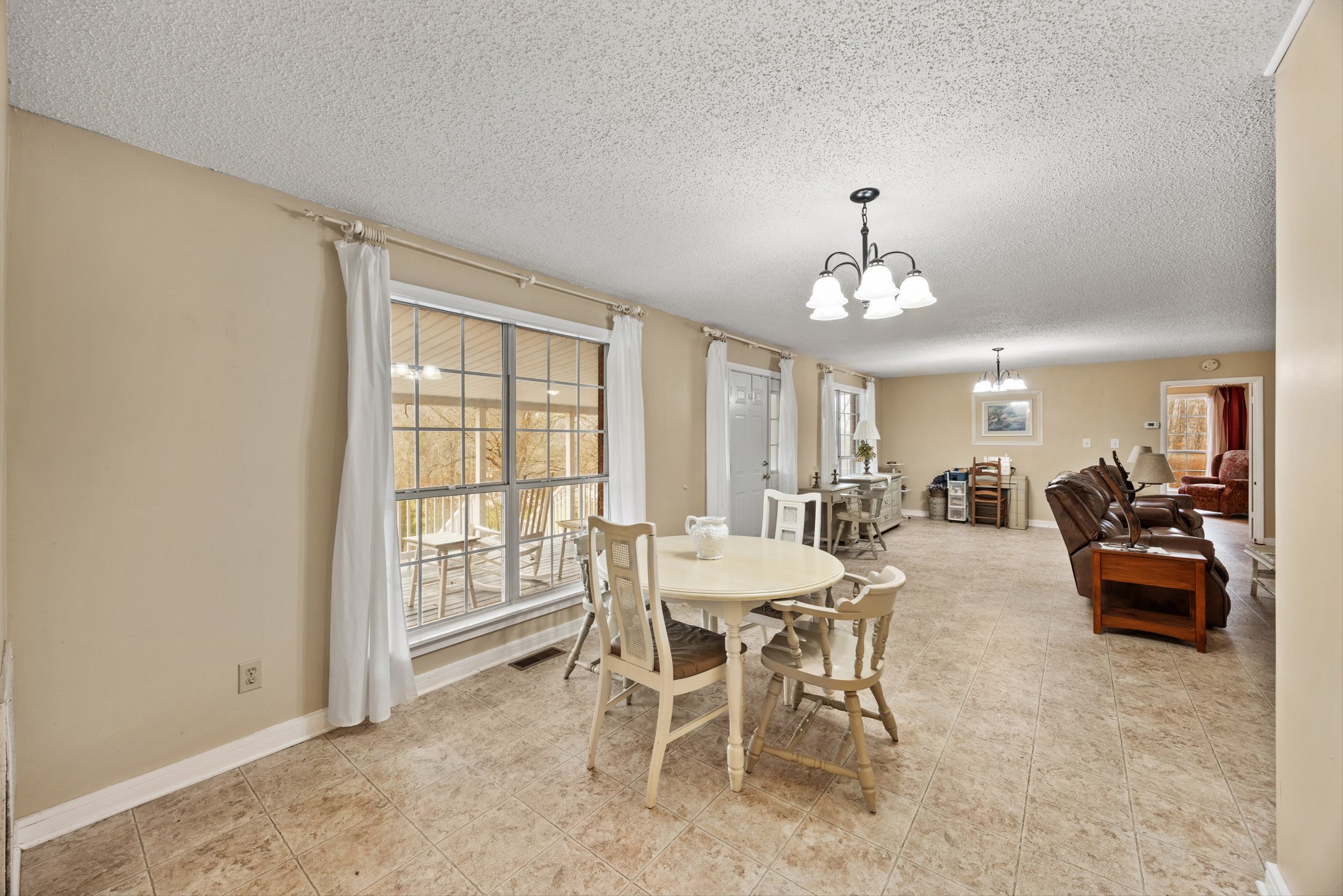 631 Holt Hollow Road Prospect, TN 38477 - Photo 10 of 41 a view of a dining room with furniture and chandelier