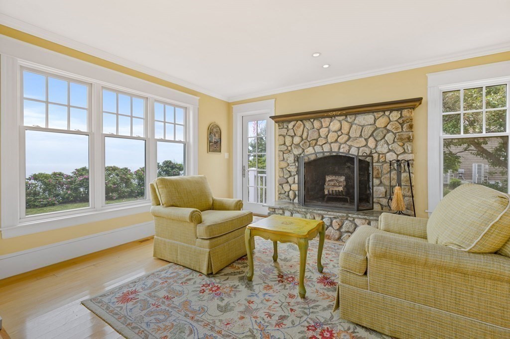 79 Gilson Road Scituate, MA 02066 - Photo 14 of 42 a living room with furniture and a fireplace