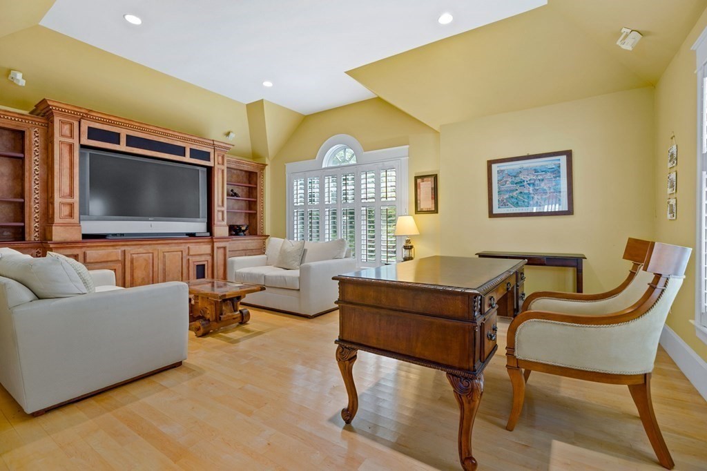 79 Gilson Road Scituate, MA 02066 - Photo 17 of 42 a living room with furniture and a flat screen tv