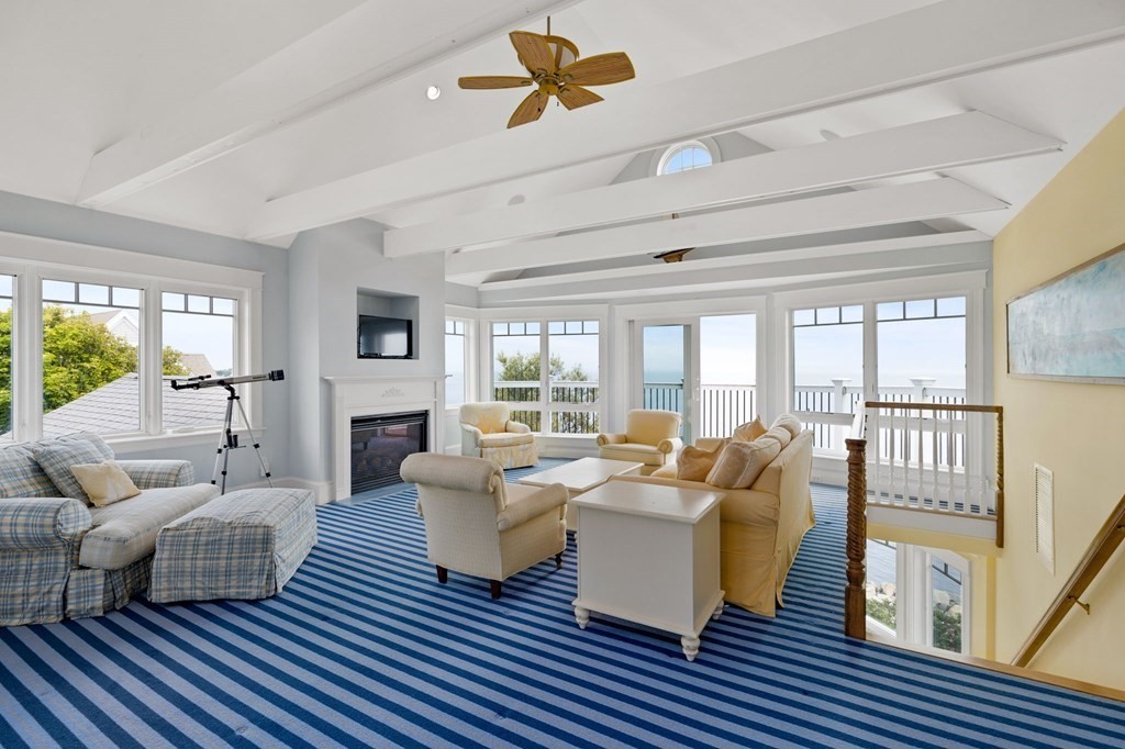 79 Gilson Road Scituate, MA 02066 - Photo 30 of 42 a living room with furniture floor to ceiling window and wooden floor