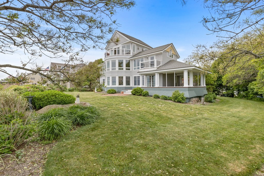 79 Gilson Road Scituate, MA 02066 - Photo 41 of 42 a front view of a house with a yard