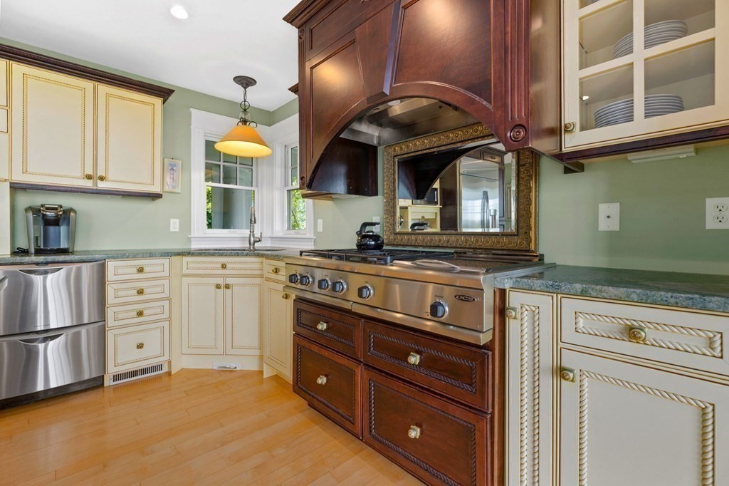 79 Gilson Road Scituate, MA 02066 - Photo 10 of 42 a kitchen with stainless steel appliances granite countertop a sink and cabinets