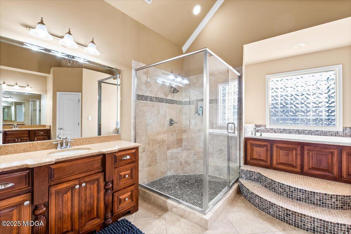204 Cashmere Court Centerville, GA 31028 - Photo 15 of 51 a bathroom with a granite countertop sink a mirror a bathtub and shower
