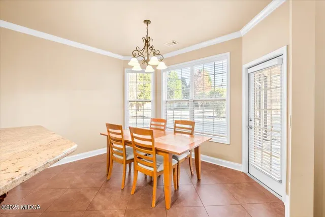 a open kitchen with stainless steel appliances granite countertop a refrigerator stove microwave and sink