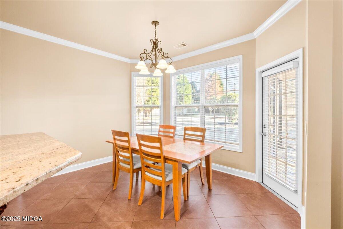 204 Cashmere Court Centerville, GA 31028 - Photo 22 of 51 a dining room with furniture and chandelier