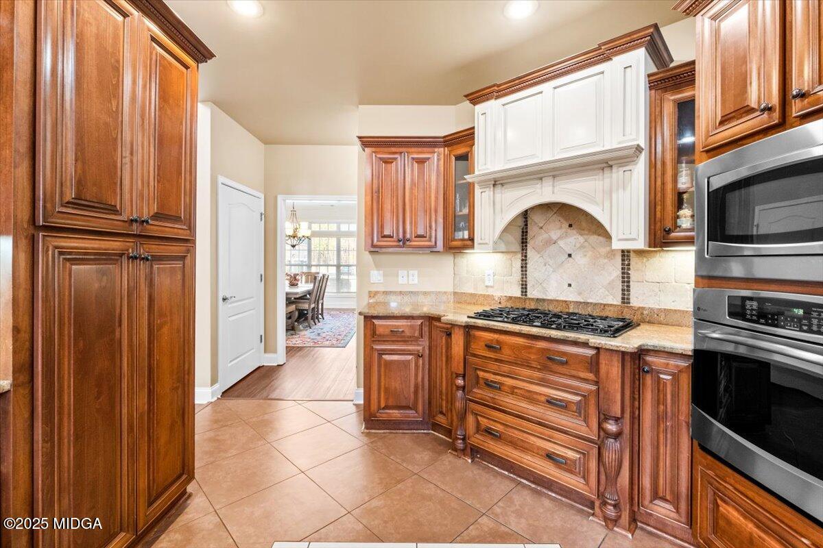 204 Cashmere Court Centerville, GA 31028 - Photo 24 of 51 a kitchen with stainless steel appliances granite countertop a stove and a refrigerator