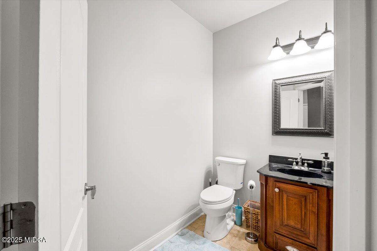 204 Cashmere Court Centerville, GA 31028 - Photo 26 of 51 a bathroom with a toilet a sink and vanity