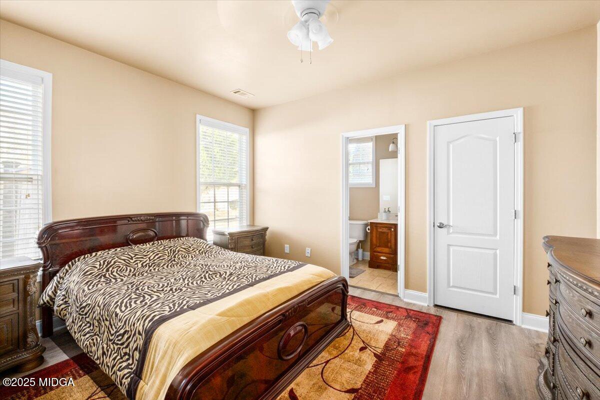 204 Cashmere Court Centerville, GA 31028 - Photo 27 of 51 a bedroom with a bed and wooden floor