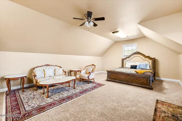 a bathroom with a toilet and a shower curtain