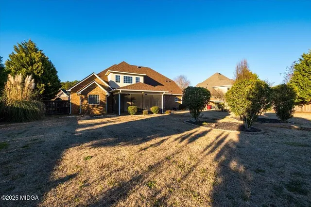 a view of a park with large trees