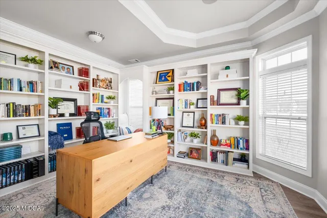 a bed room with a bed and a book shelf